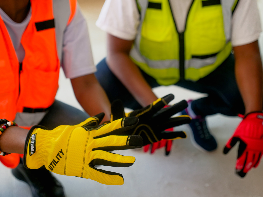 Close Up Photo of Person Holding Protective Gloves